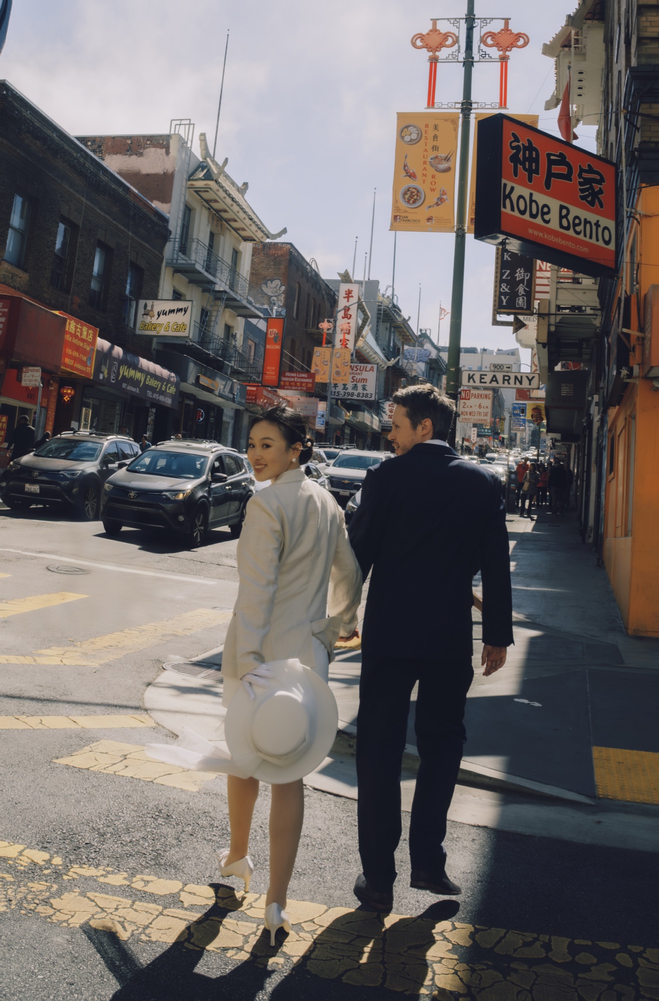 The couple walking together through Chinatown
