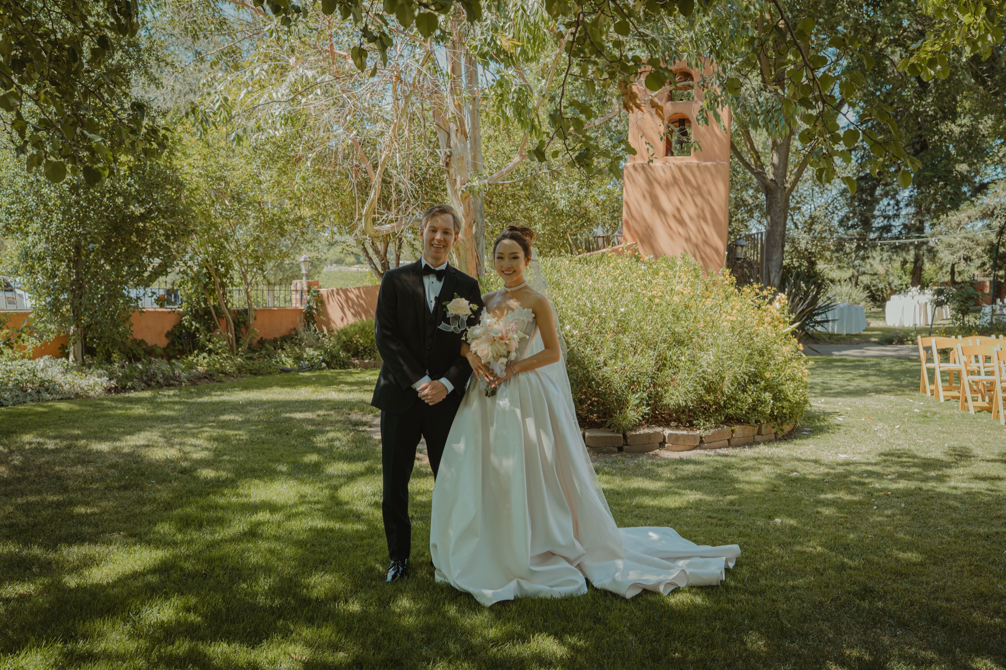 Nicole and Tanner walking together through the garden