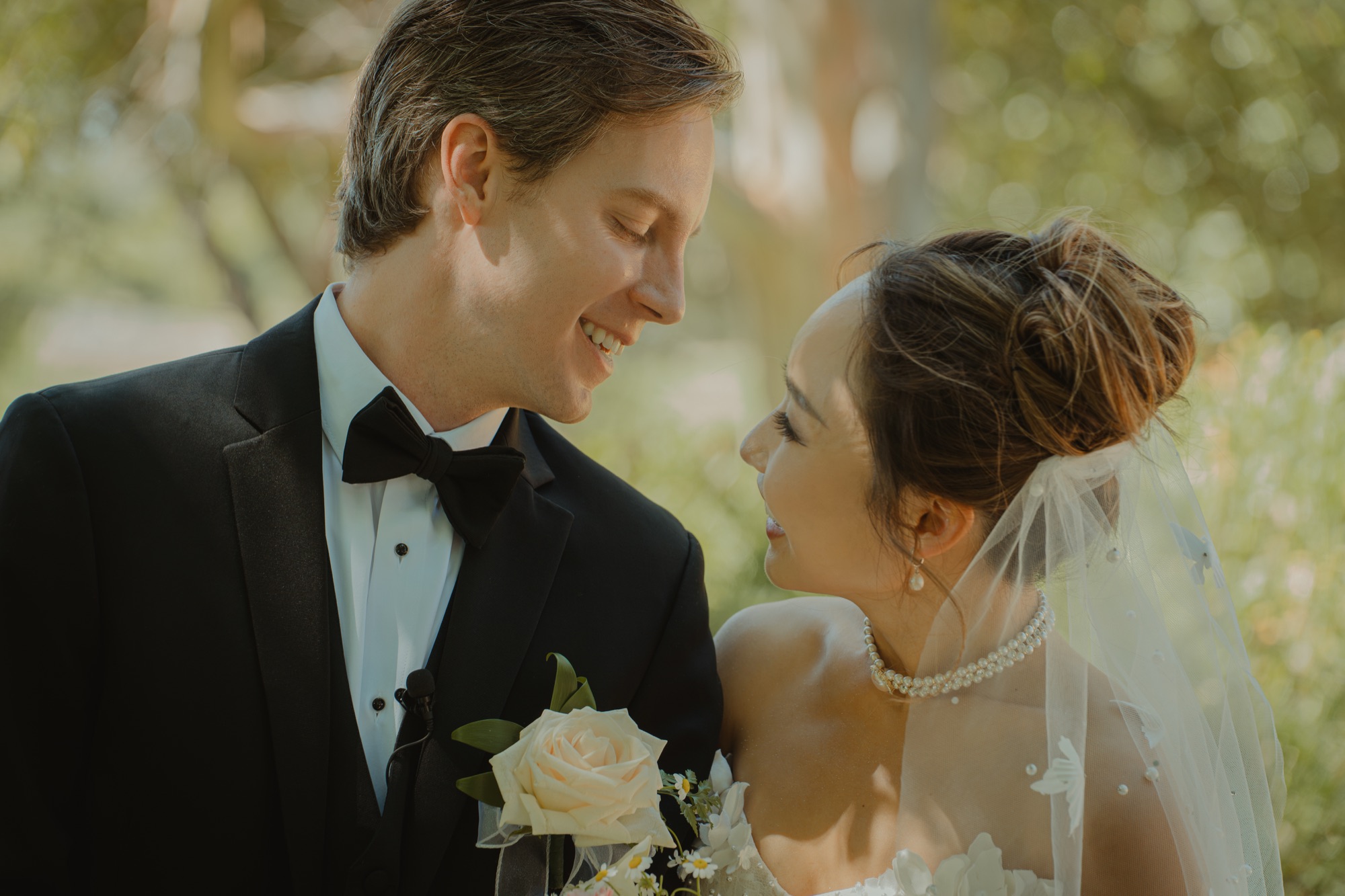 Nicole and Tanner smiling at one another