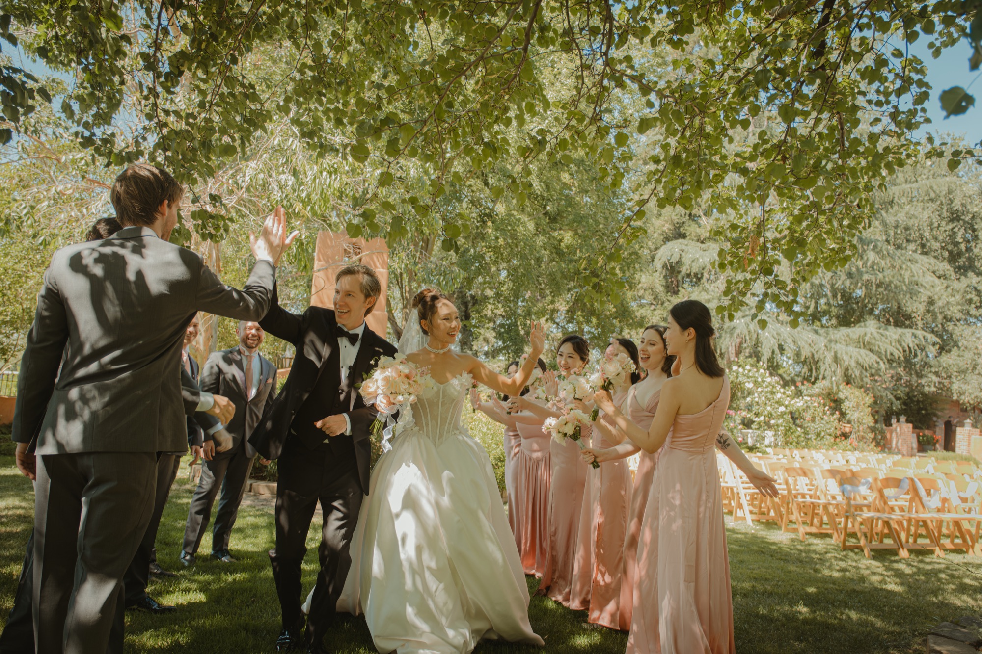 The wedding party celebrating with Nicole and Tanner