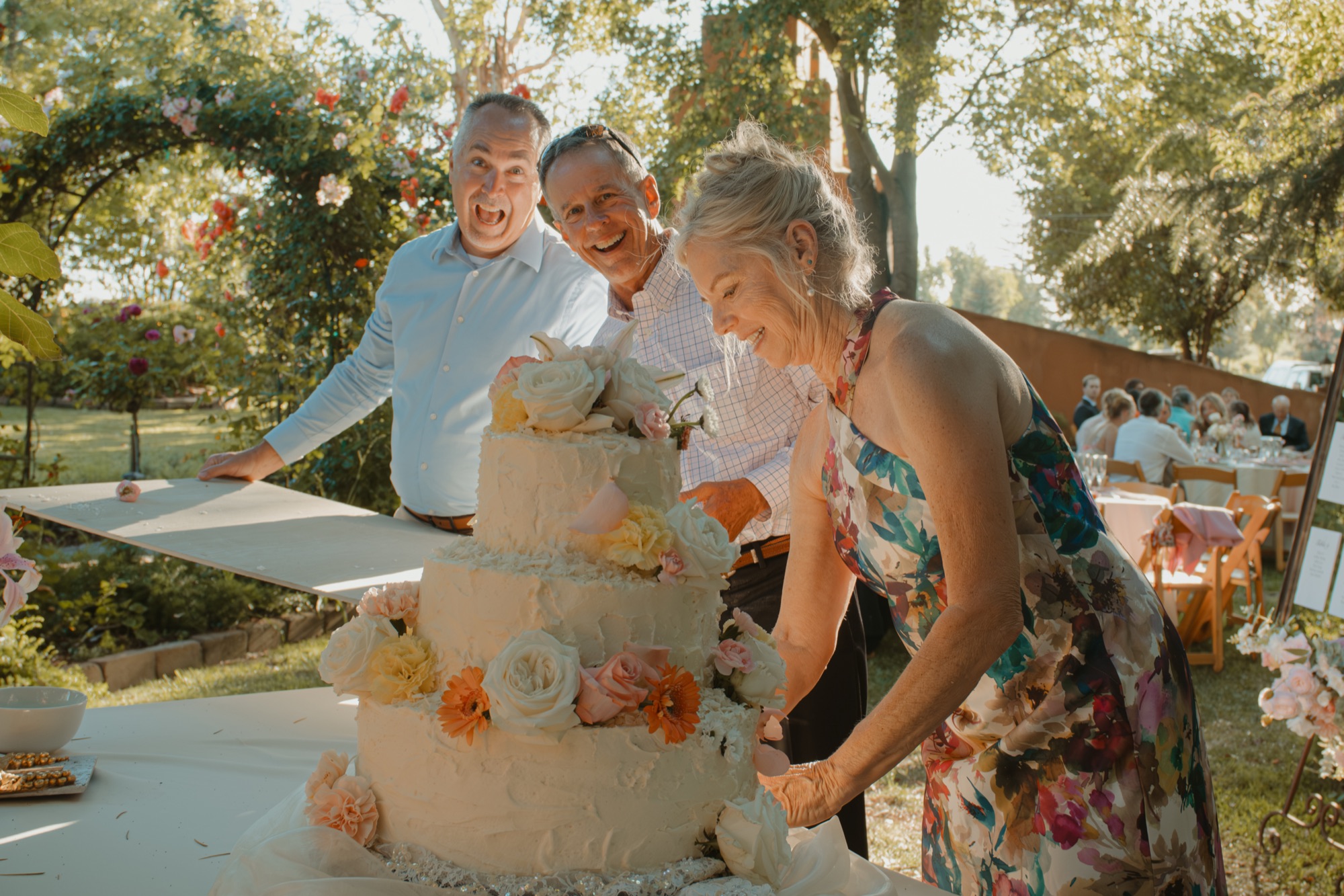 Nicole and Tanner cutting their wedding cake