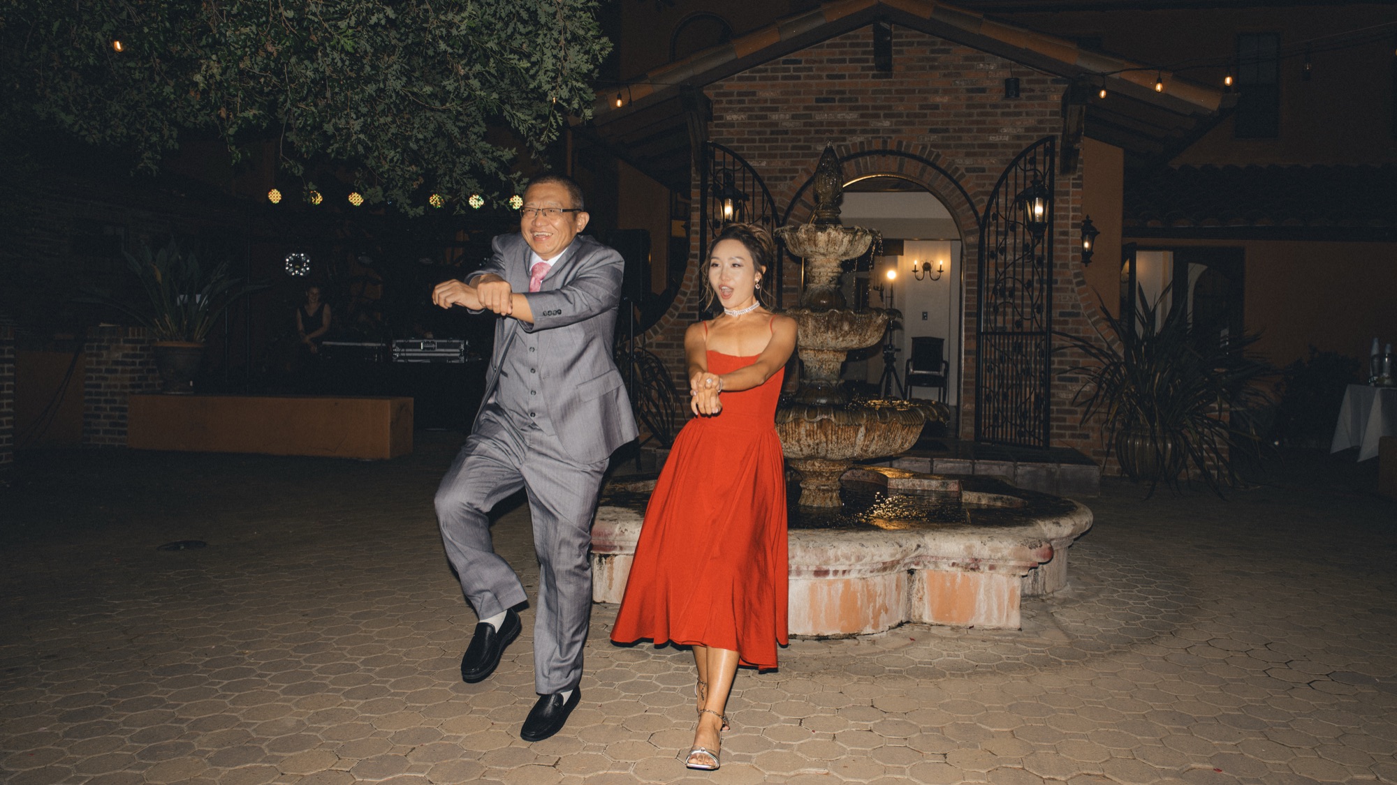 Nicole and Tanner dancing together at night