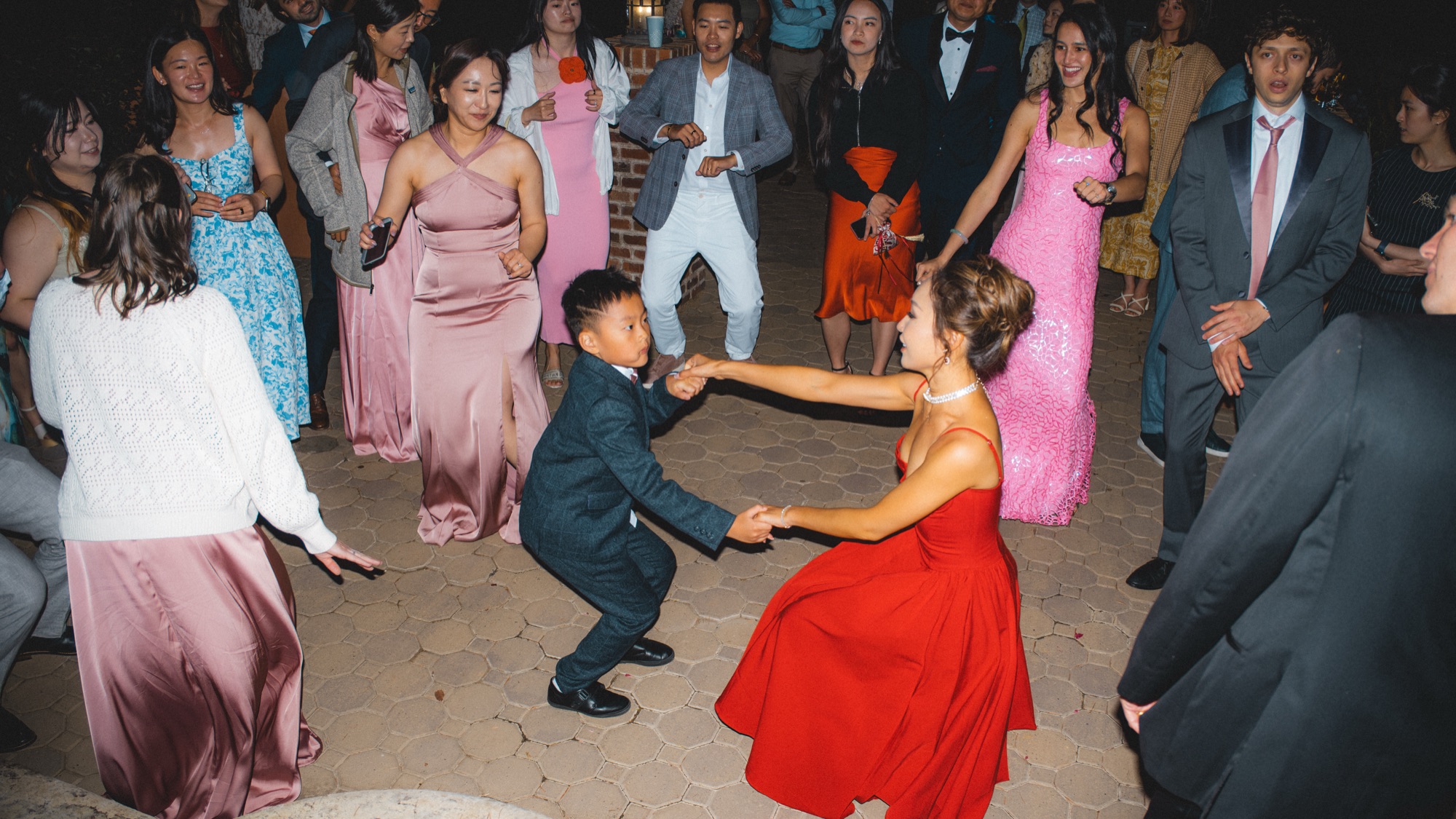 Friends surrounding Nicole and Tanner on the dance floor